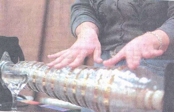 Mayling Garcia plays her armonica by placing moistened fingers on the bowls